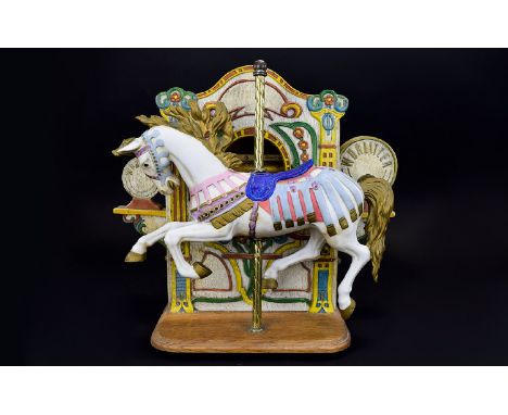 A Reproduction Musical Ceramic Carousel Horse Figure Ceramic figure against wooden box, painted with pastel fairground motifs