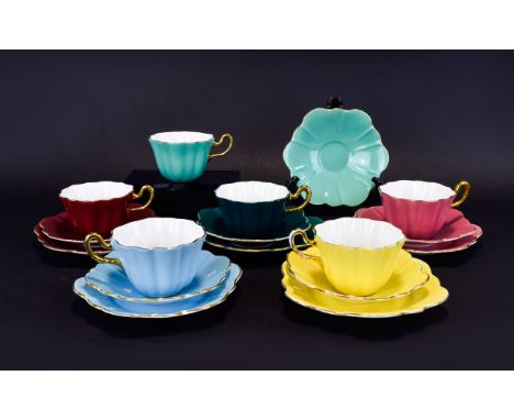 Royal Stuart Spencer Stevenson Harlequin ( 17 ) Piece Tea Service. Comprises 5 Trios + 1 Cup and Saucer. Signed In Gold to Un