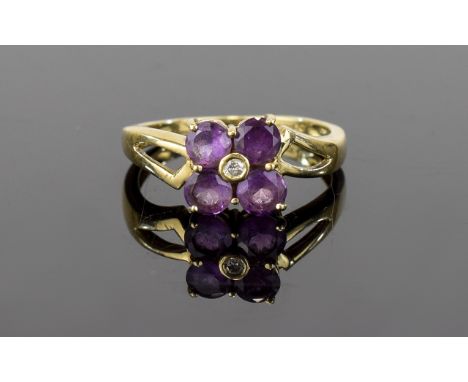 9ct Diamond Amethyst Ring Attractive flowerhead setting comprising four faceted amethyst stones with central crystal