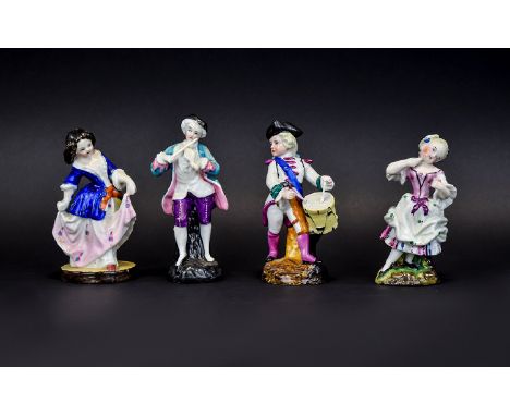Two Matched Pairs of Fairing Figures, the first pair dressed in white with magenta decoration shows a girl coquettishly apply