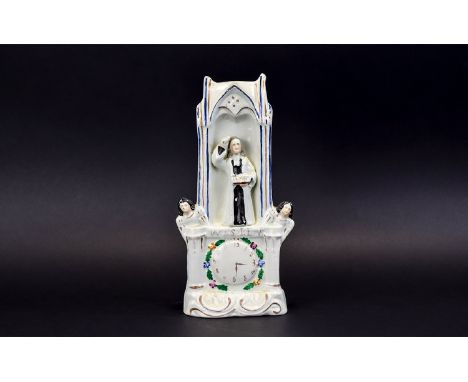 Staffordshire 19th Century Multi-Coloured Wesley Clock Group. c.1860, Features John Wesley Preaching From a Pulpit, Above a C