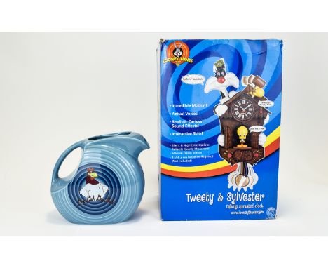 Tweety & Sylvester Talking Animated Clock with box. Approx 11 inches in height and a Warner Bros Blue Bugs Bunny china jug. 