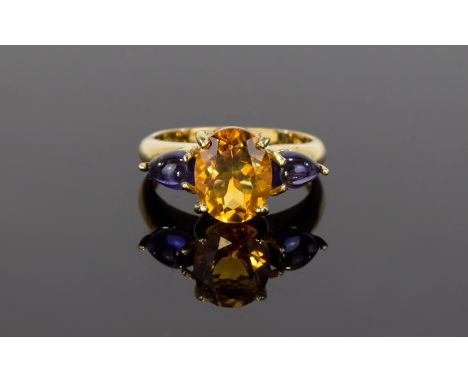 9ct Sapphire And Fire Opal Ring Gold ring with central statement faceted oval fire opal and small cabochons to shoulders