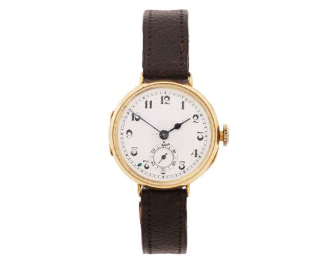 the unsigned white enamel dial with Arabic numerals, outer minutes track and subsidiary seconds dial at the 6 o'clock positio