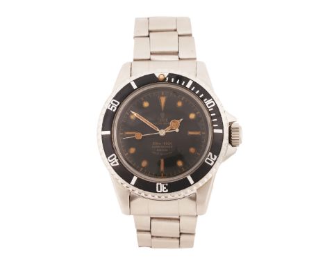 model no.7928, case no. 338318, the interior caseback dated II 60, the signed black dial with roundel, baton and triangular m