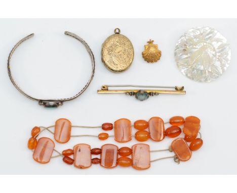 A group of jewellery to include an amber bracelet, a gold plated bar brooch with blue paste stone and seed pearls, a Victoria