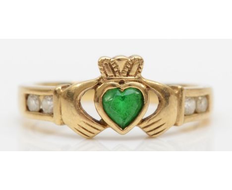 A 9ct gold paste stone Claddagh ring, K, 2gm.Condition report - The green paste stone is rubbed to the table with a small ble