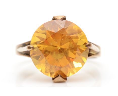 A gold synthetic yellow sapphire cocktail ring, O, 4.7gm, partially rubbed mark, believed to be stamped 14k. 