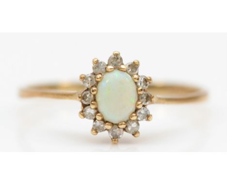 A 9ct gold opal and brilliant cut diamond ring, O-P, 1.3gm. 