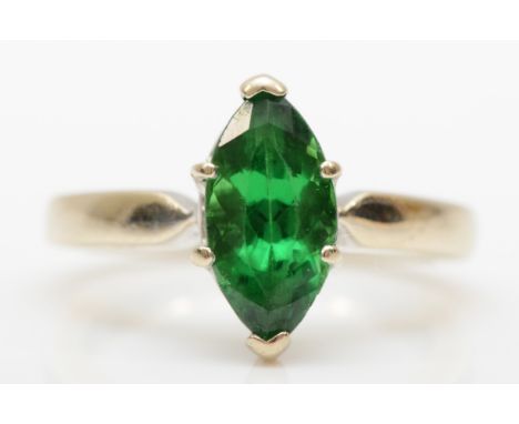 An 18k white gold marquise cut green garnet dress ring, J, 4.2gm. 