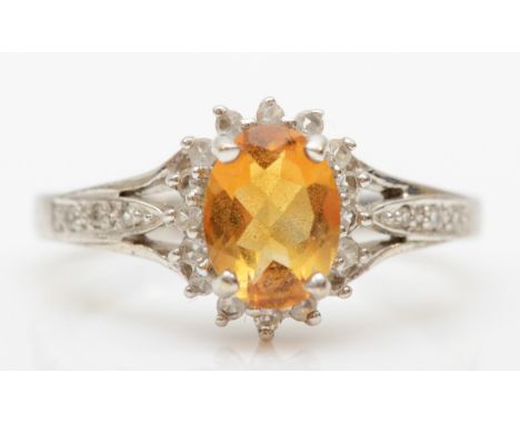 A 9ct white gold citrine and cz cluster ring, N-O, 3.2gm. 