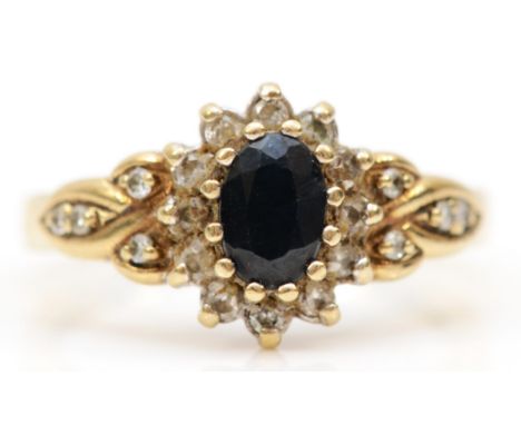 A 9ct gold sapphire and diamond cluster ring, M, 3.1gm. 