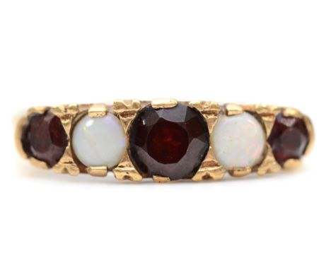 A 9ct gold garnet and opal five stone ring, L-M, 2.1gm. 