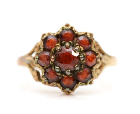 A 9ct gold garnet cluster ring, K, 1.9gm. 