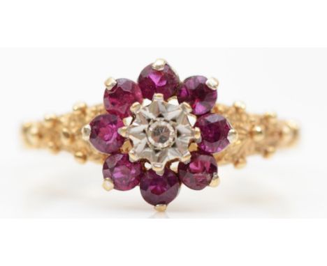 A 9ct gold ruby and eight cut illusion set diamond cluster ring, O-P, 2gm. 