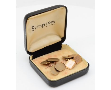 A pair of 9ct gold oval cuff links with engine turned decoration, and another 9ct rectangular pair, 8.9gm. 