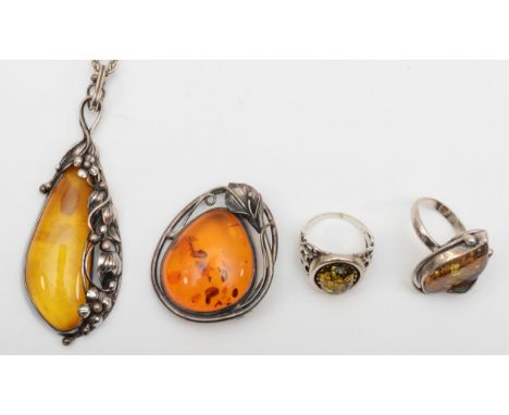 Two silver Baltic amber rings, R, a pendant on chain and brooch, 57gm. 