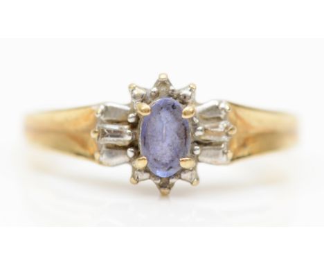 A 9ct gold tanzanite and diamond dress ring, K-L, 1.7gm. 