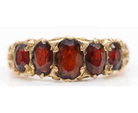 A 9ct garnet five stone dress ring, P-Q, 4gm. 