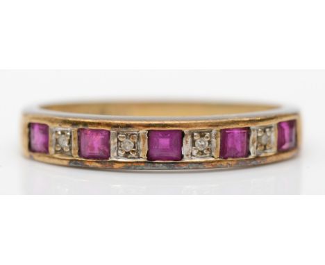 A 9ct gold ruby and melee diamond dress ring, N, 1.5gm. 