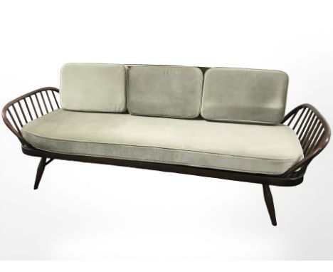 An Ercol stained elm day bed, length approximately 208 cm depth 72 cm 