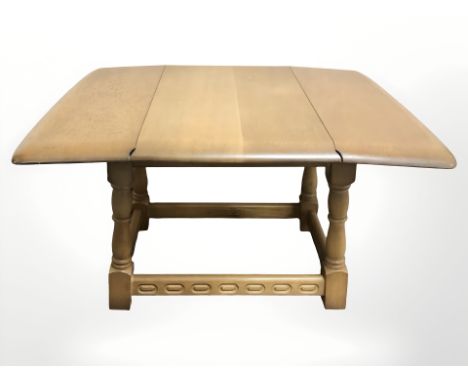 An Ercol low occasional table, width 68 cm.