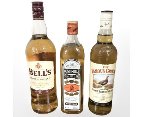Three bottles of scotch whisky to include Bell's finest eight year old scotch, 1L, The Famous Grouse finest scotch, 70cl, and