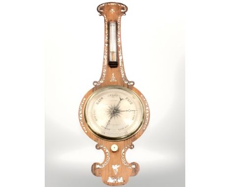 A 19th century rosewood barometer, inlaid with mother of pearl.