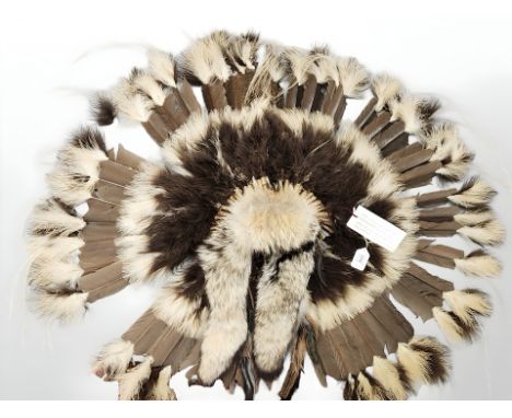 A Native American Brown Prairie Fur and Feather Headdress, with the original "Home of Native American Art" retail ticket, cre