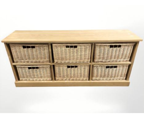A contemporary light oak six drawer wicker chest, width 151 cm 