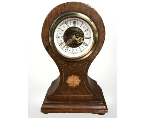 An inlaid mahogany balloon mantel clock, height 17 cm.