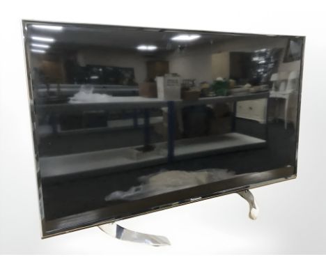 A Panasonic 40" LED Television set, together with the romote control unit and user manual. 