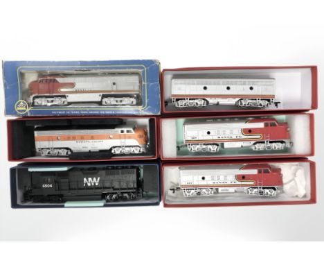 A group of six Bachmann HO scale model railway engines and tenders.