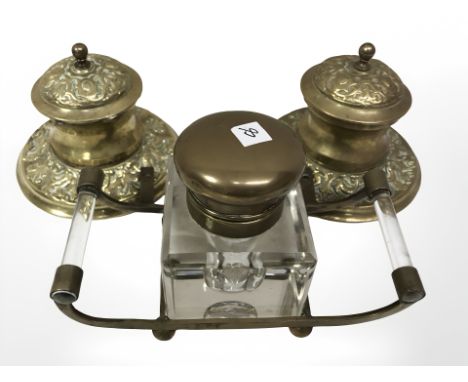 A pair of Victorian brass inkwells together with a further glass inkwell on stand.