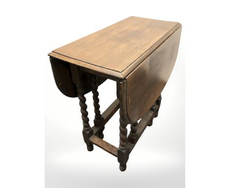 A 1920's oak gate leg table, width 75 cm 