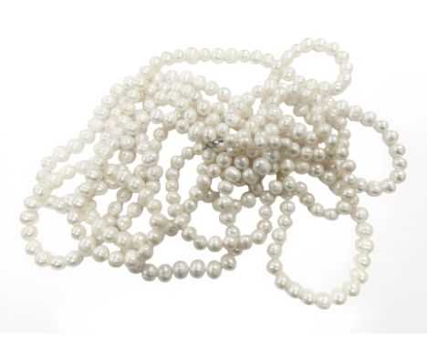 Two long cultured pearl necklaces and a further pearl necklace. (3)