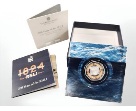 A Royal Mint 2024 silver proof 50p colour coin celebrating 200 years of the RNLI, with certificate of authenticity.