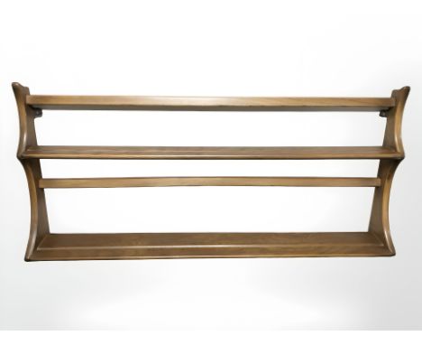 An Ercol plate rack, width 97 cm.