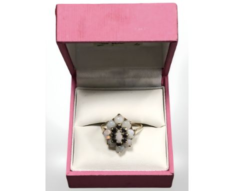 A 9ct yellow gold synthetic opal and sapphire cluster ring, size N. CONDITION REPORT: 4g.