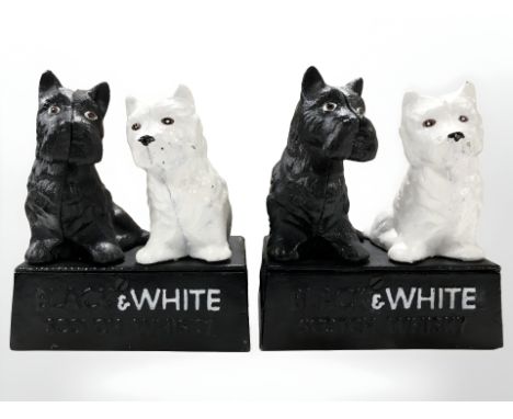 A pair of Black & White scotch whisky advertising cast iron figures.