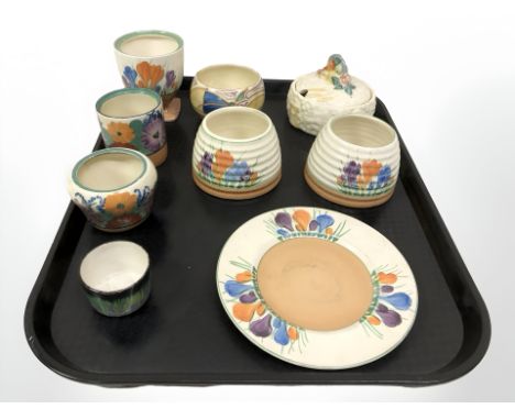 A group of Clarice Cliff porcelain to include Crocus pattern plates, preserve pots, Harvest pattern lidded pot, etc. (9)