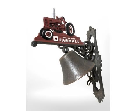 A cast iron tractor bell on bracket.
