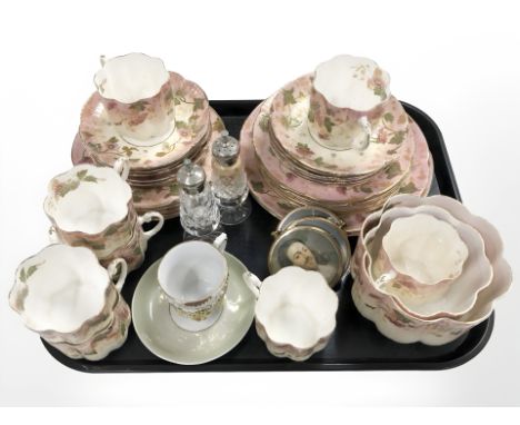 A tray of antique gilded floral tea china, pair of crystal salt and pepper sifters, gold plated framed portrait prints.