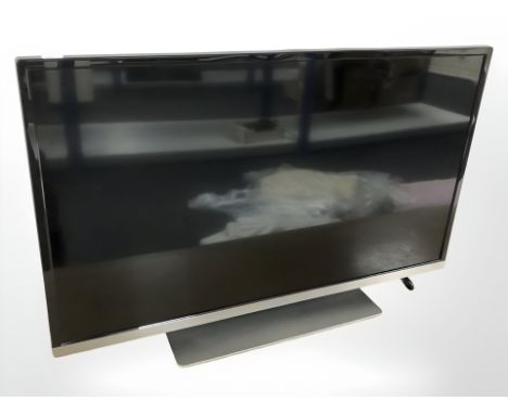 A Panasonic 32" LED Television set, together with user manual and remote control unit. 
