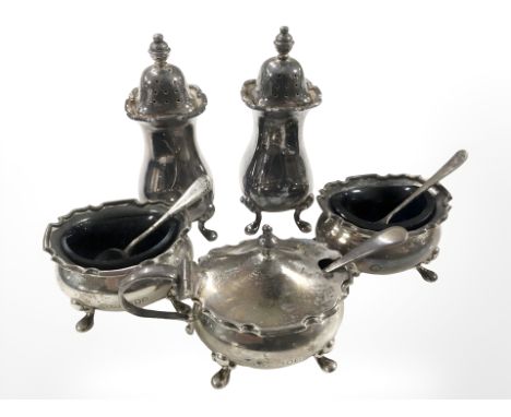 A five piece silver cruet set including pair of salts, pair of peppers and mustard pot.