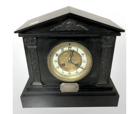 A Victorian slate mantel clock.
