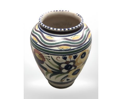 A Poole pottery vase decorated with flower, numbered 336, height 18 cm.