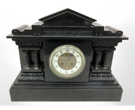 A Victorian black slate mantel clock, width 44 cm.
