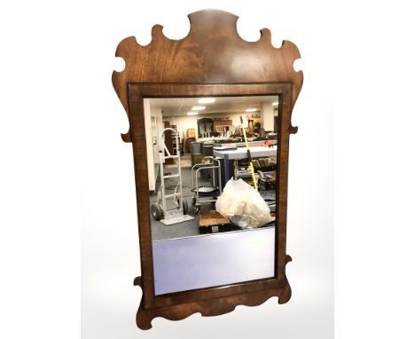 A Chippendale-style mahogany mirror, 40 cm x 71 cm, together with a further Chippendale-style mirror. (2)