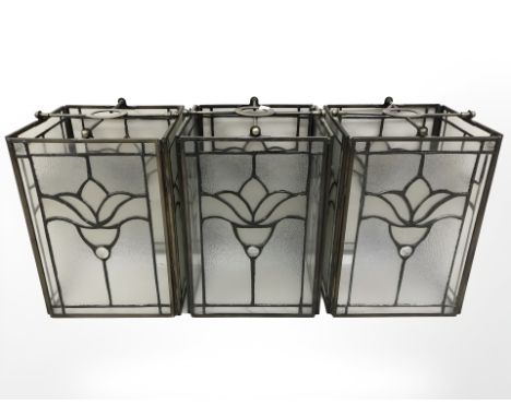 Three antique-style glazed metal light shades, each width 16 cm.